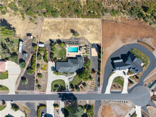 an aerial view of houses with outdoor space