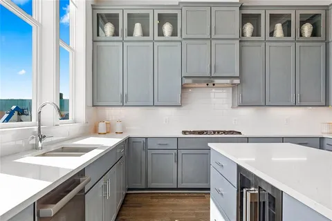 a kitchen with a table and chairs in it