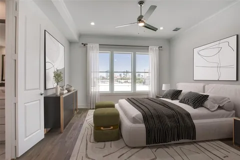 a bedroom with a large bed and a window