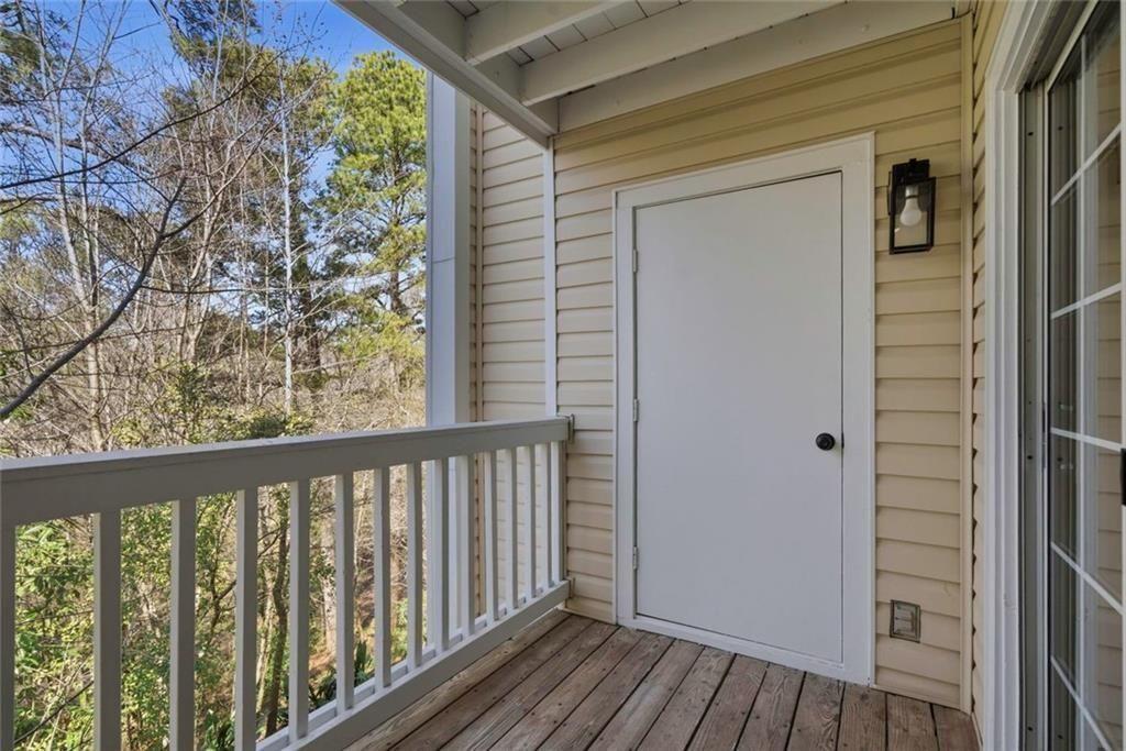 402 Countryside Place, Unit 402 Smyrna, GA 30080 - Photo 12 of 55 a view of a balcony with wooden floor