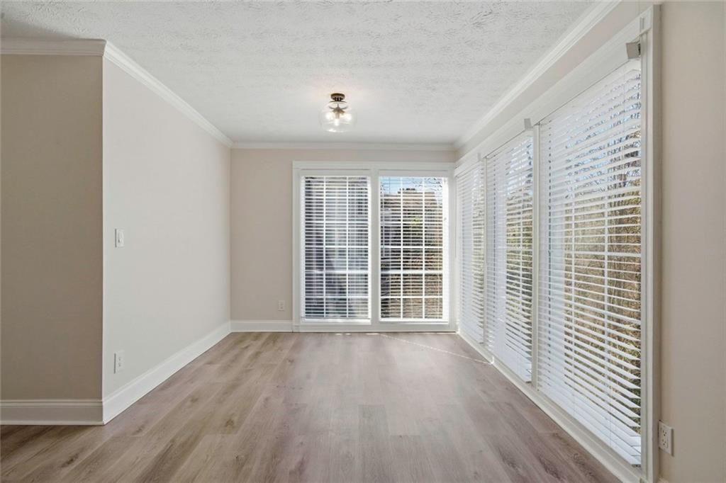 402 Countryside Place, Unit 402 Smyrna, GA 30080 - Photo 19 of 55 wooden floor in an empty room with a window