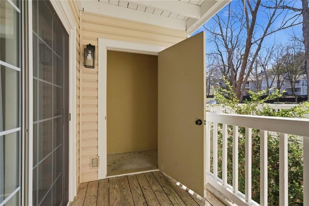 402 Countryside Place, Unit 402 Smyrna, GA 30080 - Photo 24 of 55 a view of a porch with wooden floor and fence