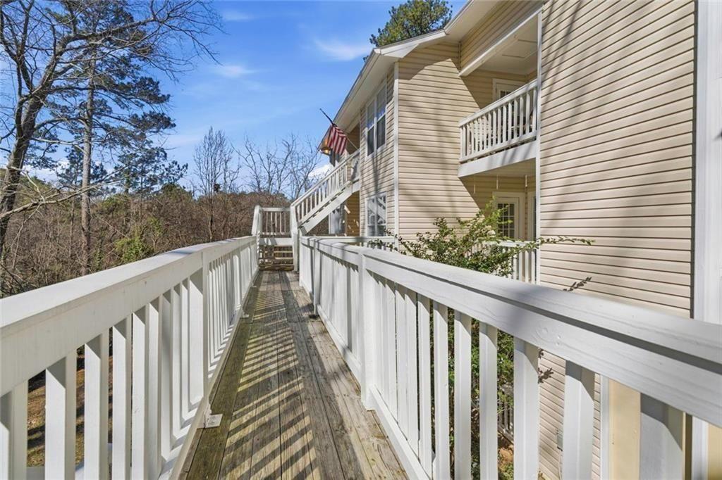 402 Countryside Place, Unit 402 Smyrna, GA 30080 - Photo 4 of 55 a view of a balcony with wooden fence and floor