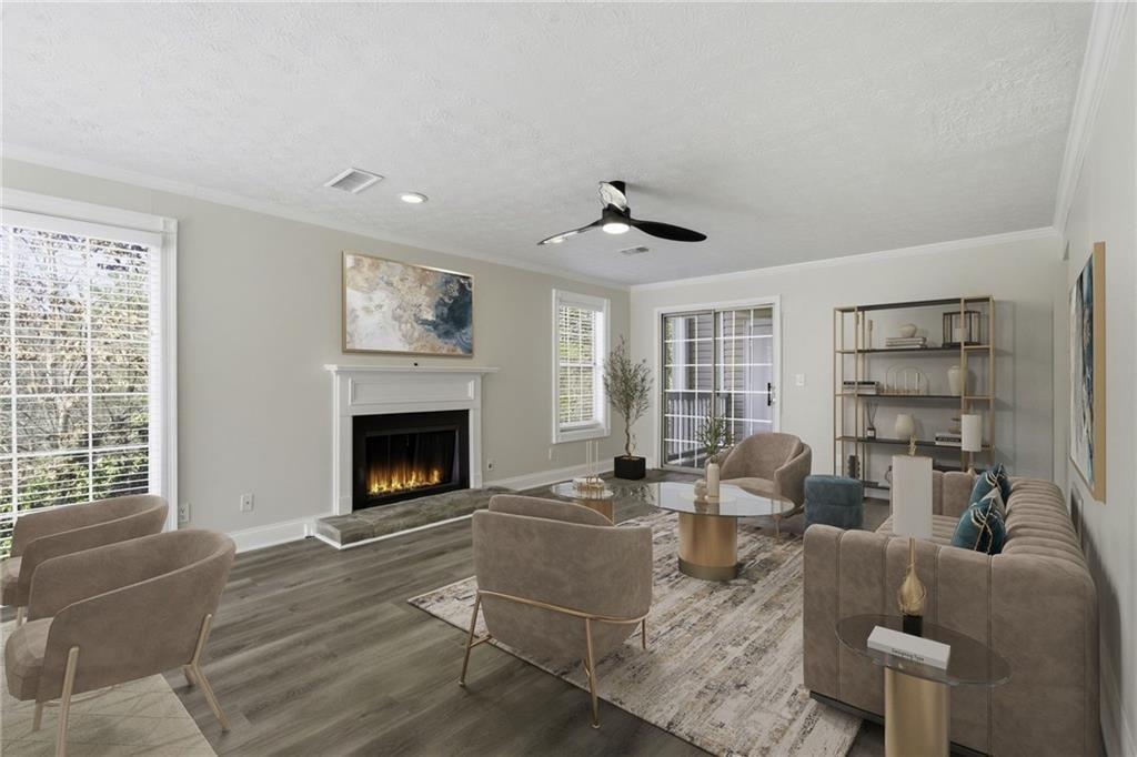 402 Countryside Place, Unit 402 Smyrna, GA 30080 - Photo 10 of 55 a living room with furniture a fireplace and a large window