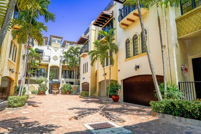 a view of a palm trees in front of a building