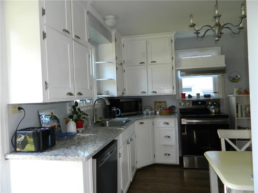 2130 Huntington Street Bethlehem, PA 18017 - Photo 10 of 23 A well-appointed kitchen features ample white cabinetry and durable stone counters for daily living.