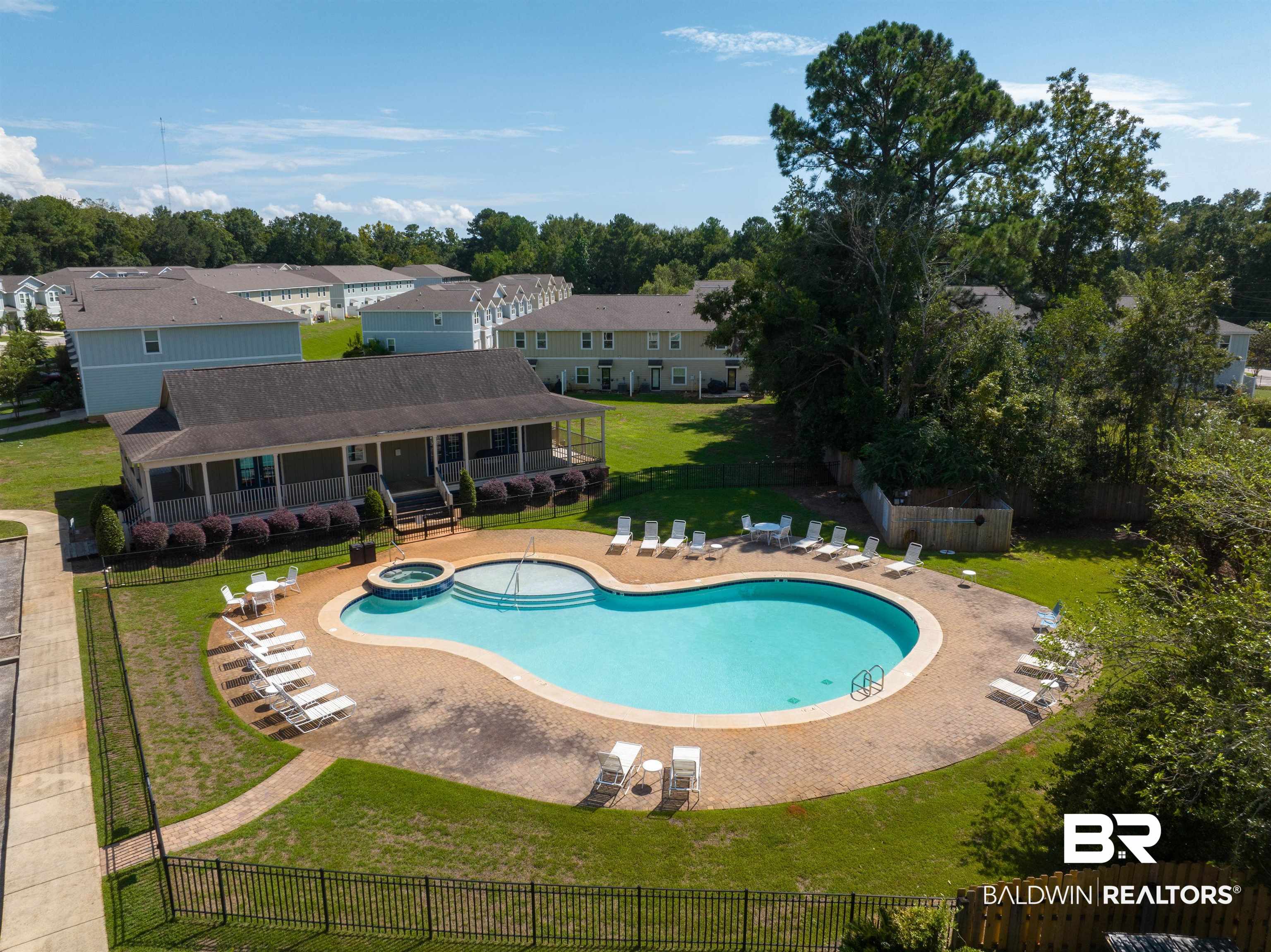 25806 Pollard Road, Unit 32 Daphne, AL 36526 - Photo 21 of 23 View of pool featuring a yard and a patio area