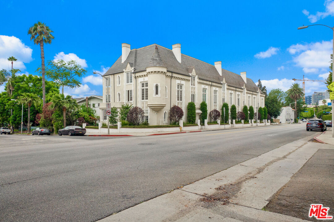 a view of a building with a street