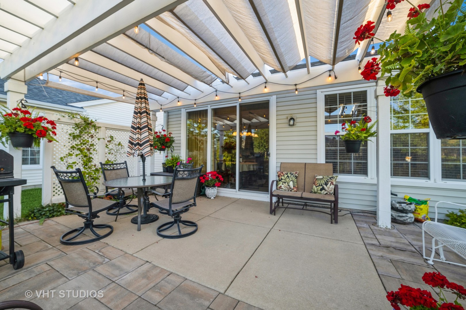 2499 Rolling Ridge Elgin, IL 60124 - Photo 3 of 17 a building outdoor space with patio furniture and potted plants