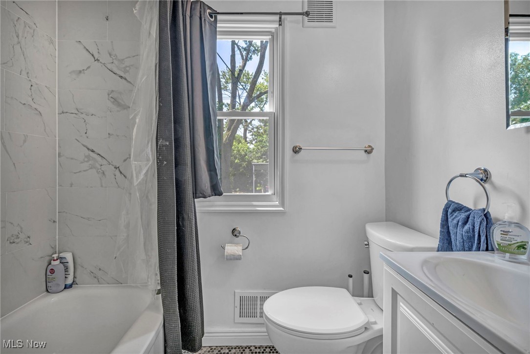 21100 Watson Road Maple Heights, OH 44137 - Photo 16 of 37 Bathroom with shower / tub combo and vanity