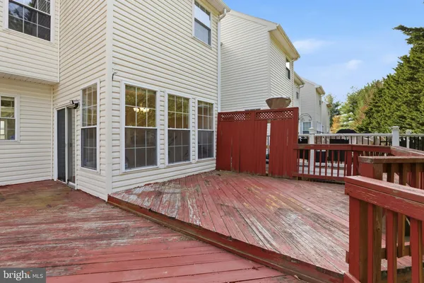 a view of wooden deck with a bench