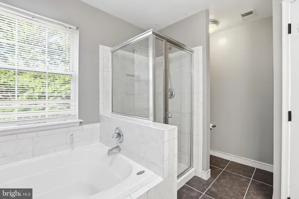 a bathroom with a sink toilet vanity and shower