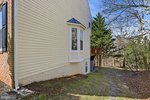 a view of a house with a yard and garage