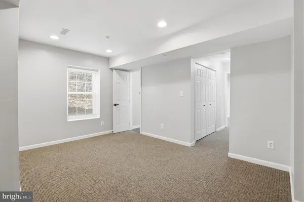 a bathroom with a window and a shower