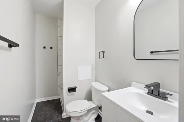 an empty room with a fireplace and a fireplace