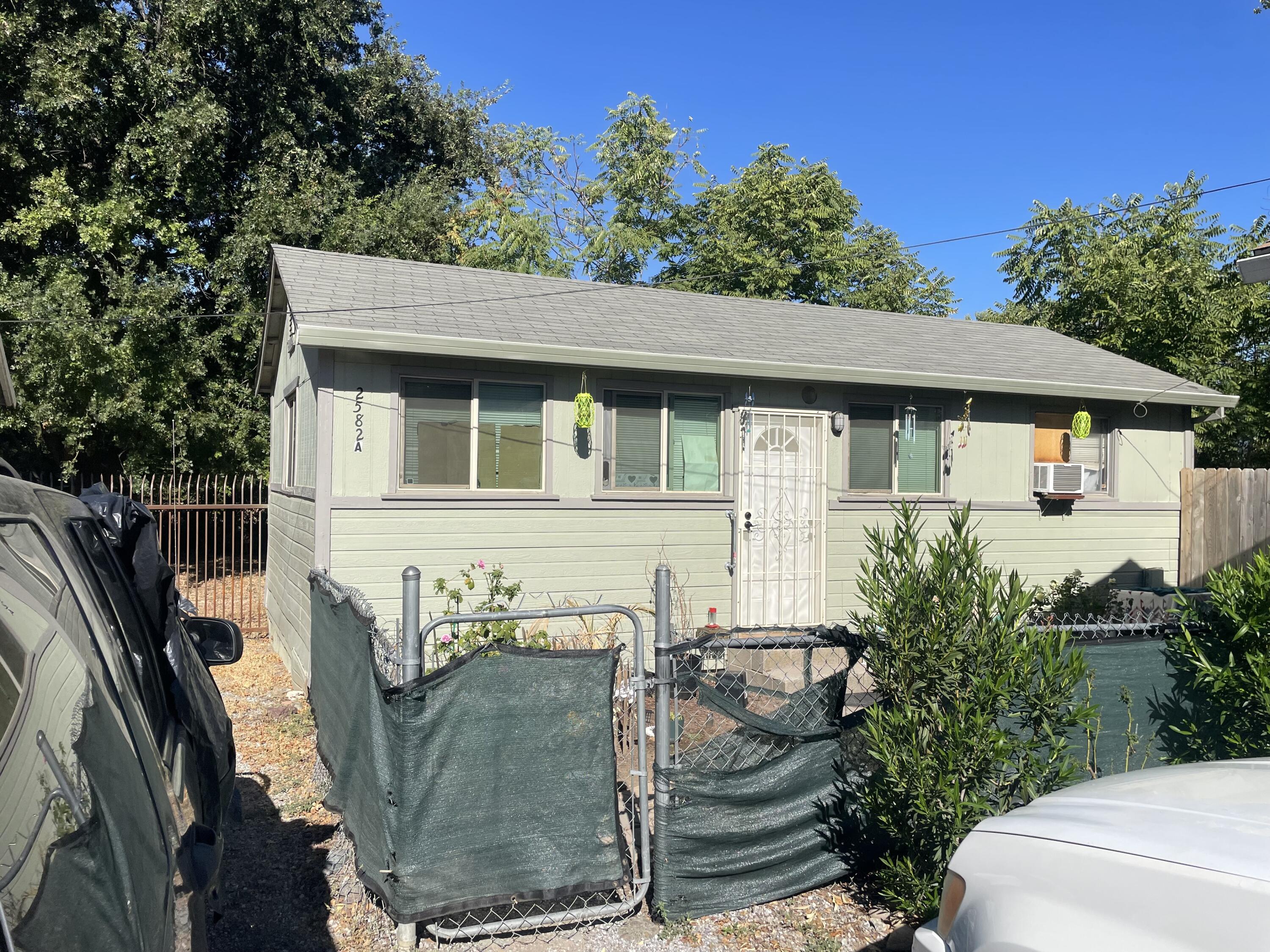 2590 Henderson Road Redding, CA 96002 - Photo 2 of 9 a front view of a house with garden