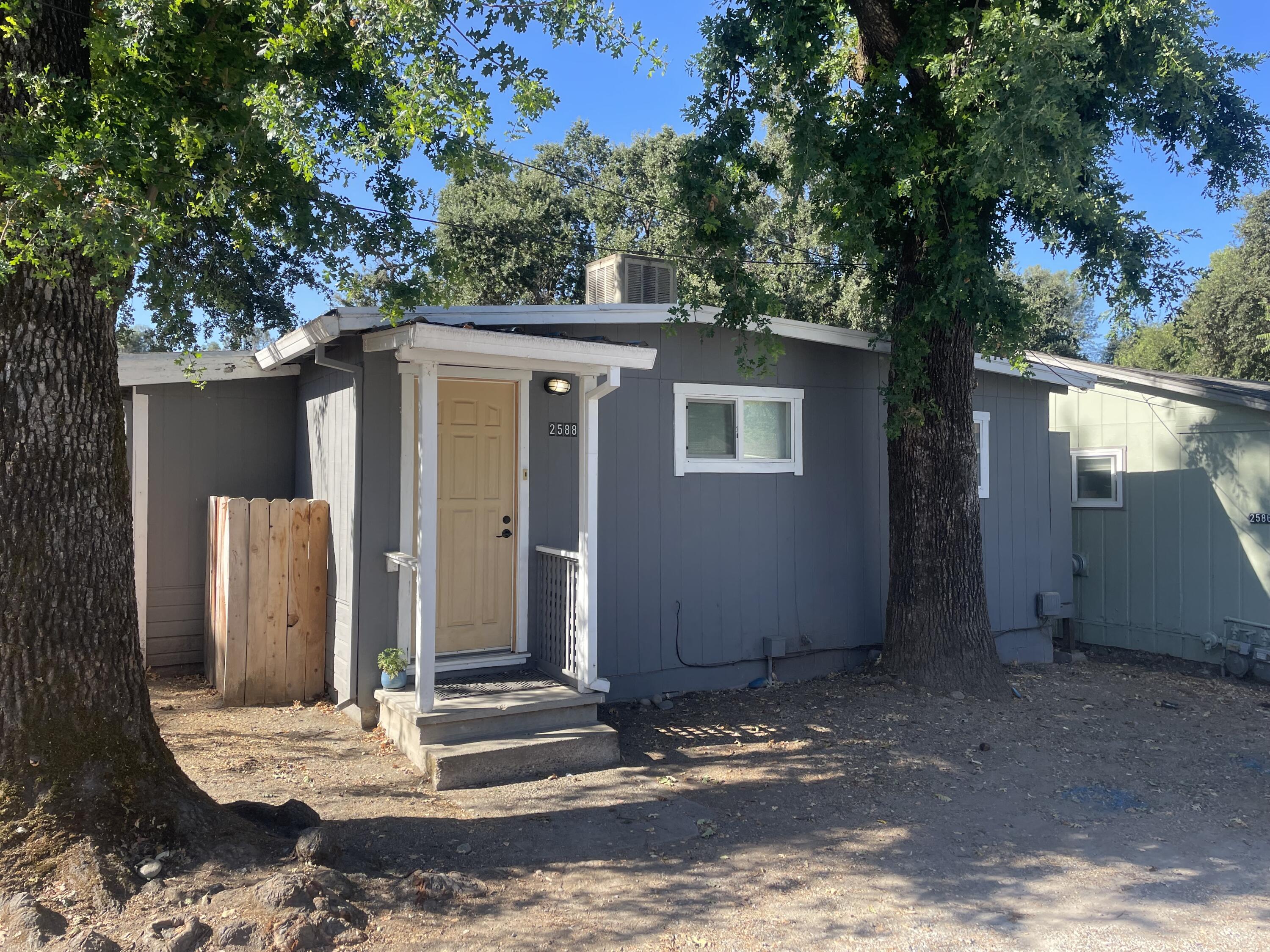 2590 Henderson Road Redding, CA 96002 - Photo 4 of 9 a view of a house with a yard