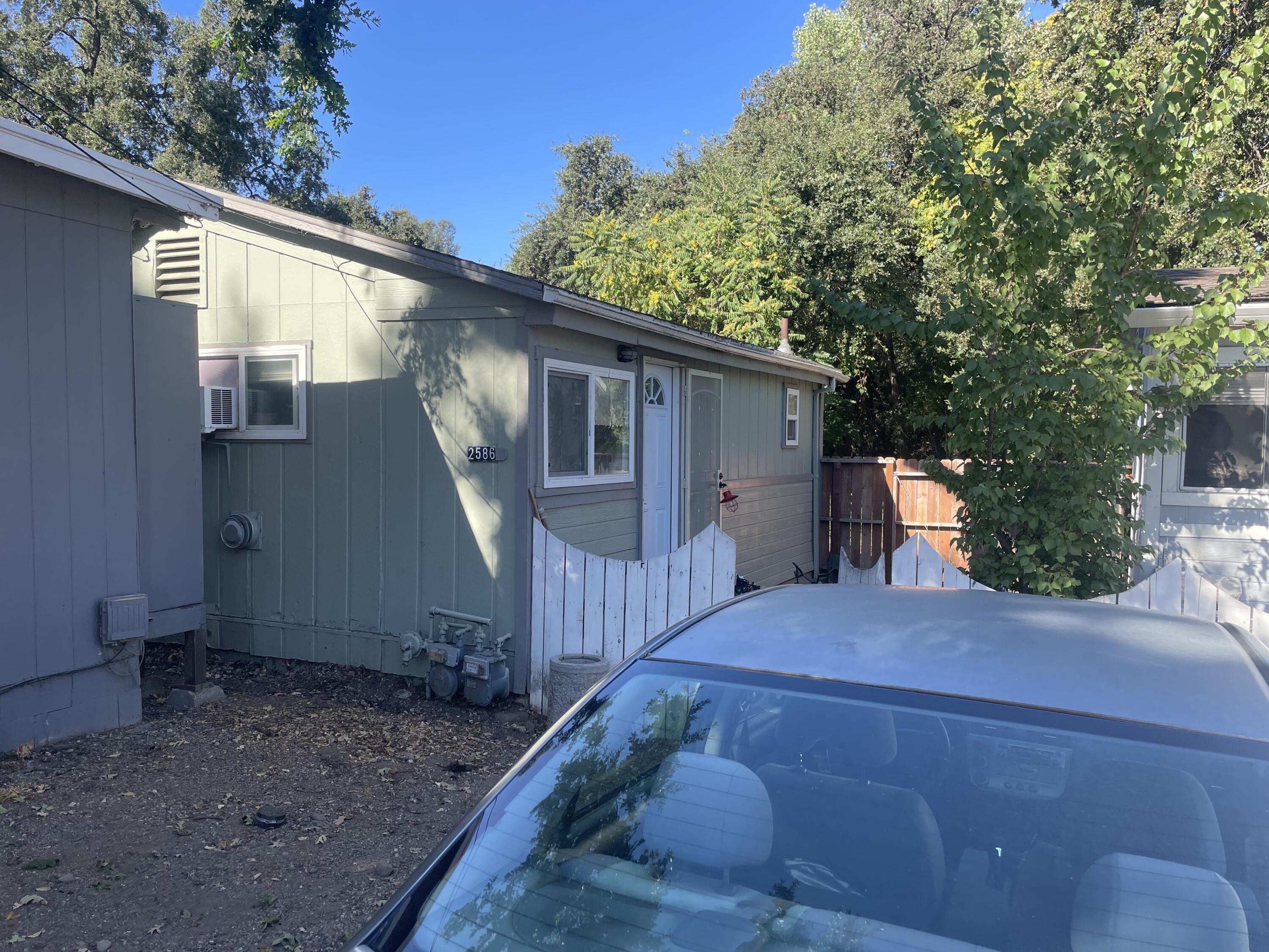 2590 Henderson Road Redding, CA 96002 - Photo 6 of 9 a view of a house with a yard