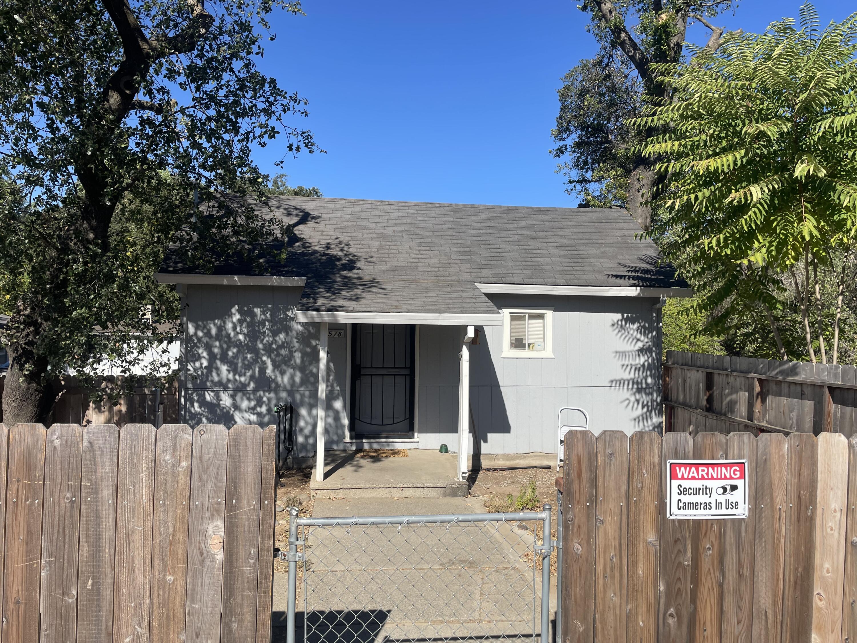 2590 Henderson Road Redding, CA 96002 - Photo 8 of 9 a front view of a house with a tree