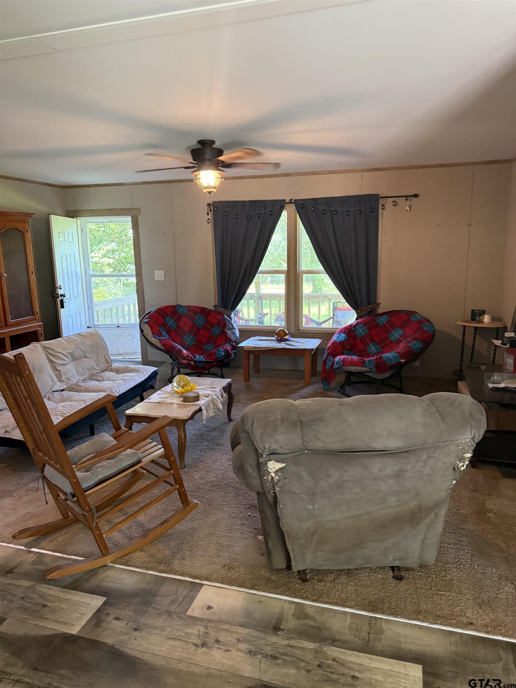 21022 County Road 240 Tyler, TX 75705 - Photo 4 of 13 a living room with a couch and a table