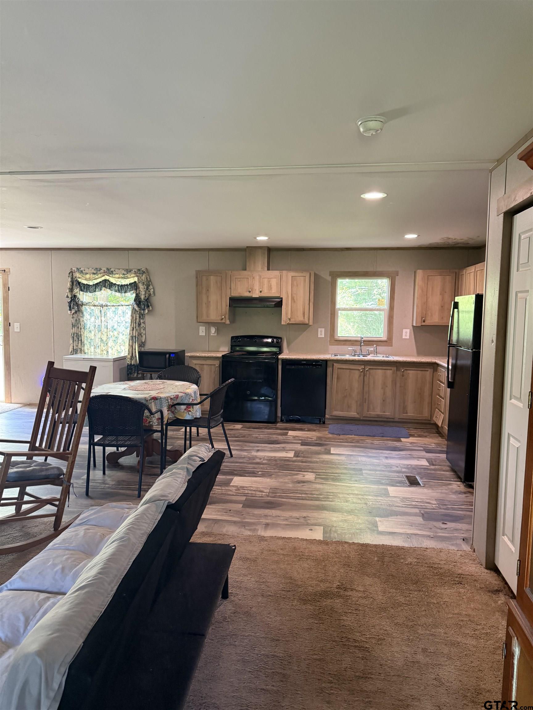 21022 County Road 240 Tyler, TX 75705 - Photo 9 of 13 a living room with furniture and a wooden floor