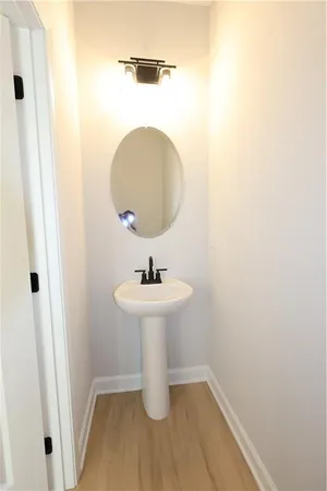 a bathroom with a sink and mirror