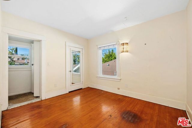 a bedroom with a bed and couch