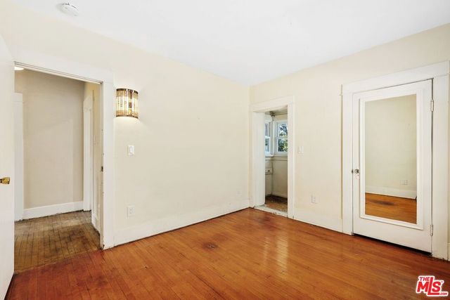 a backyard of a house with a yard and outdoor seating