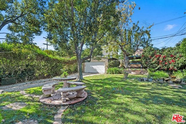 a house view with a garden space