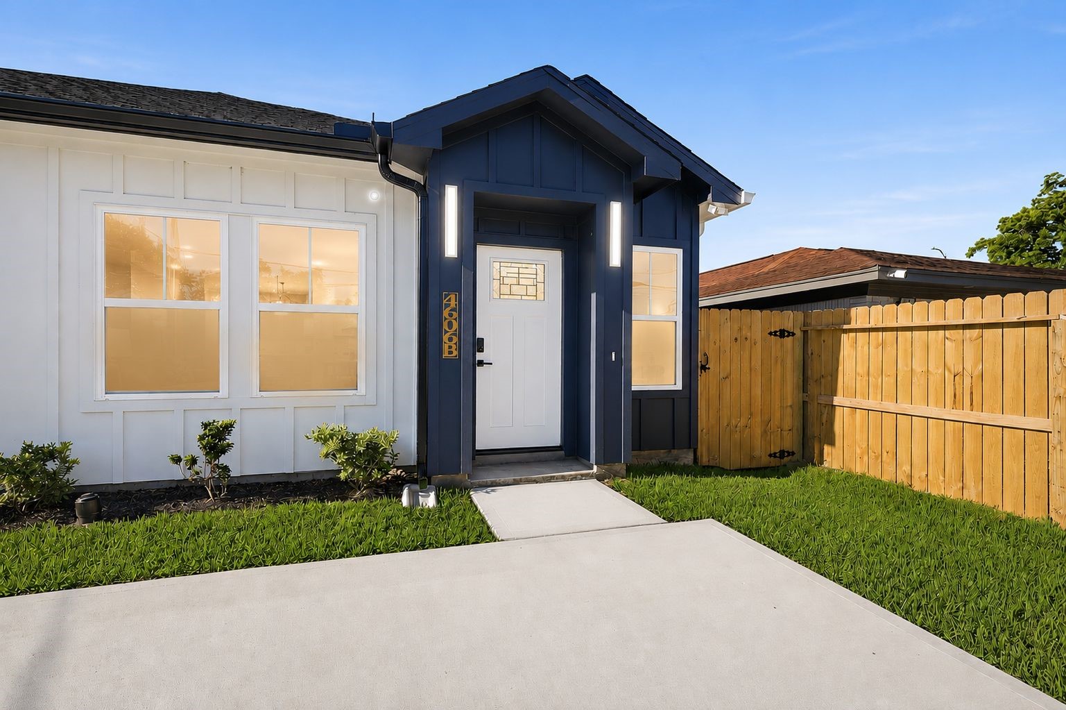 4606 Mallow Street, Unit B Houston, TX 77051 - Photo 3 of 25 a front view of a house with a yard