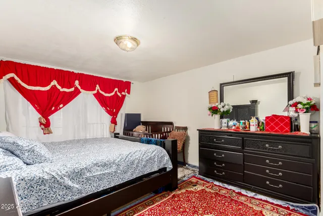 a bedroom with a bed and a walk in closet