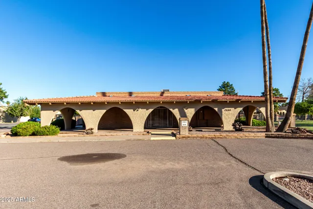 a view of a swimming pool with outdoor seating