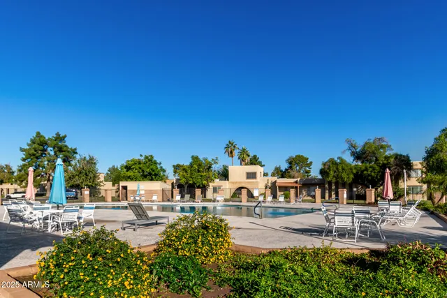 a view of swimming pool with a yard