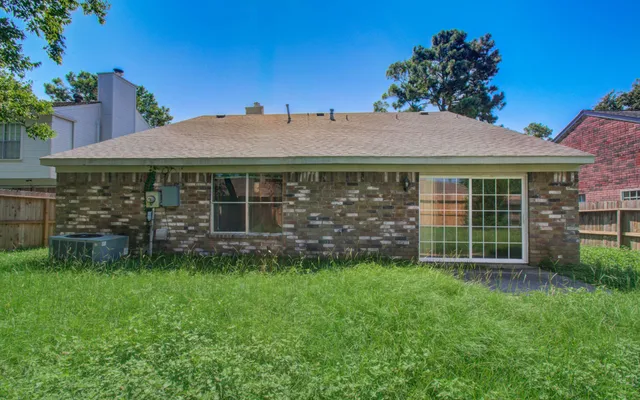 a view of a house with a garden