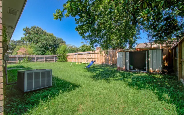 a view of backyard with green space