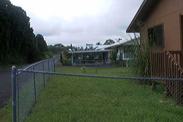 17-4006 Middle Road, Unit 102 Kurtistown, HI 96749 - Photo 11 of 15 a view of a houses and a yard in back