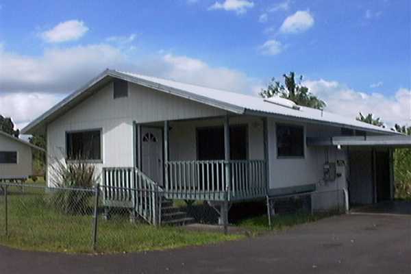 17-4006 Middle Road, Unit 102 Kurtistown, HI 96749 - Photo 13 of 15 a front view of a house with plants