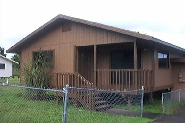 17-4006 Middle Road, Unit 102 Kurtistown, HI 96749 - Photo 3 of 15 a view of a house with a yard and deck