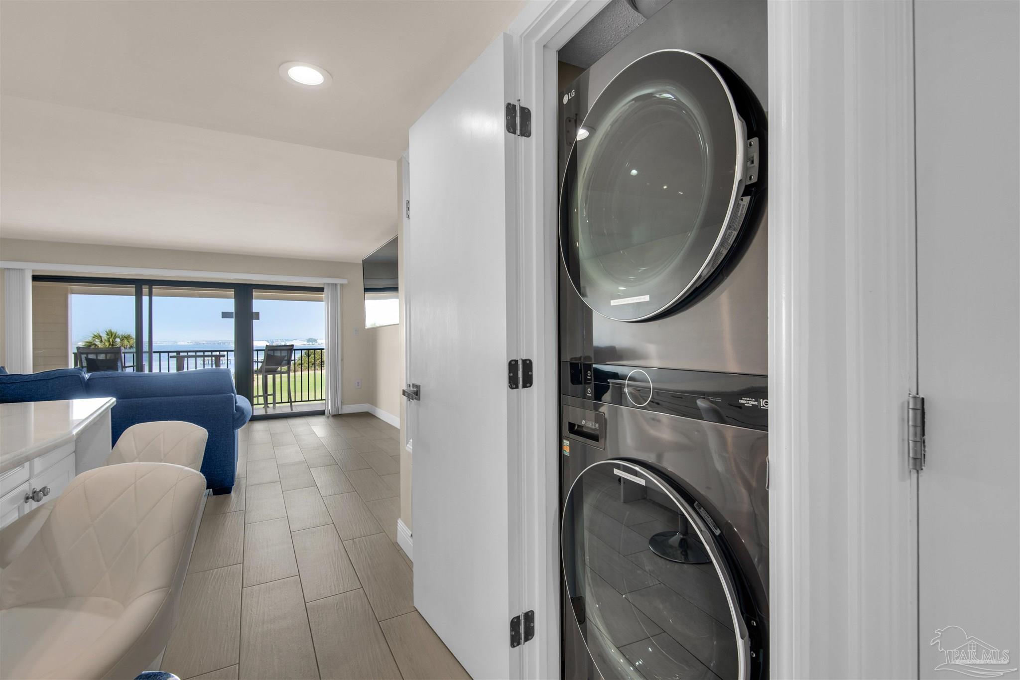 900 Fort Pickens Road, Unit 425 Pensacola Beach, FL 32561 - Photo 17 of 47 a living room with furniture and a mirror