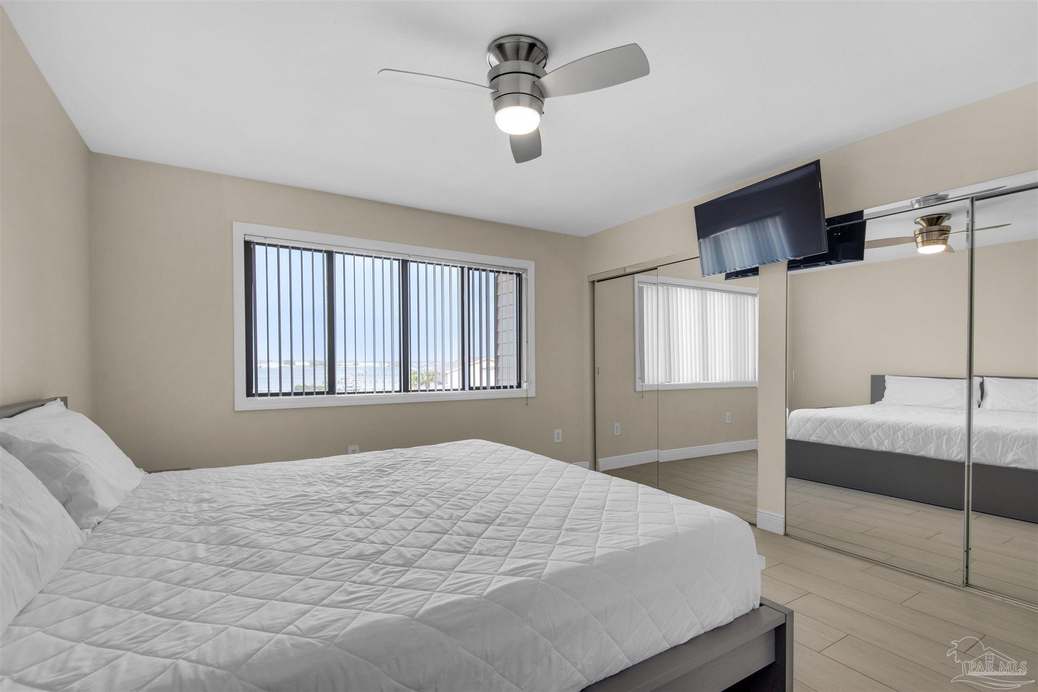 900 Fort Pickens Road, Unit 425 Pensacola Beach, FL 32561 - Photo 23 of 47 a bedroom with a large bed and a window