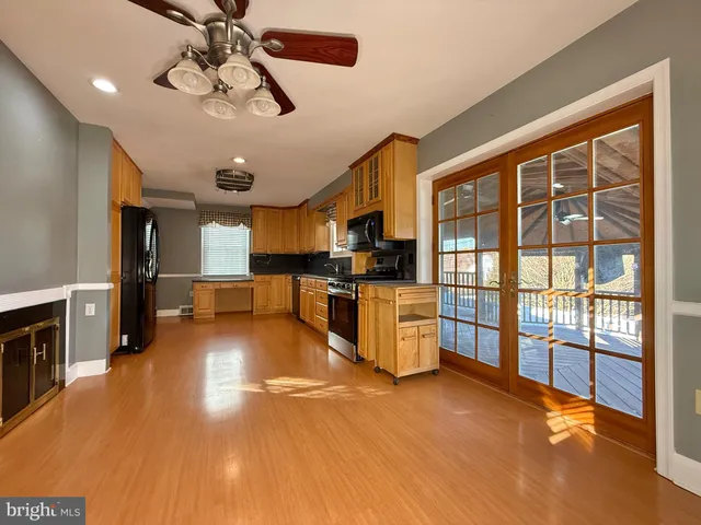 a view of a kitchen with furniture and windows