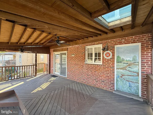 a view of a porch with wooden floor