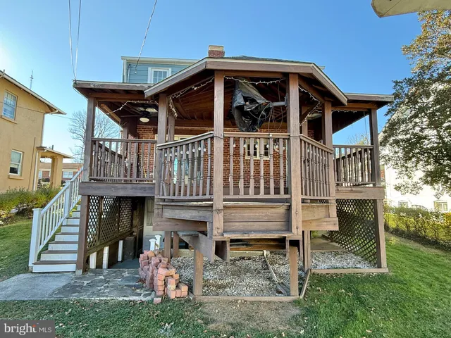 a view of a house with a yard porch and sitting area