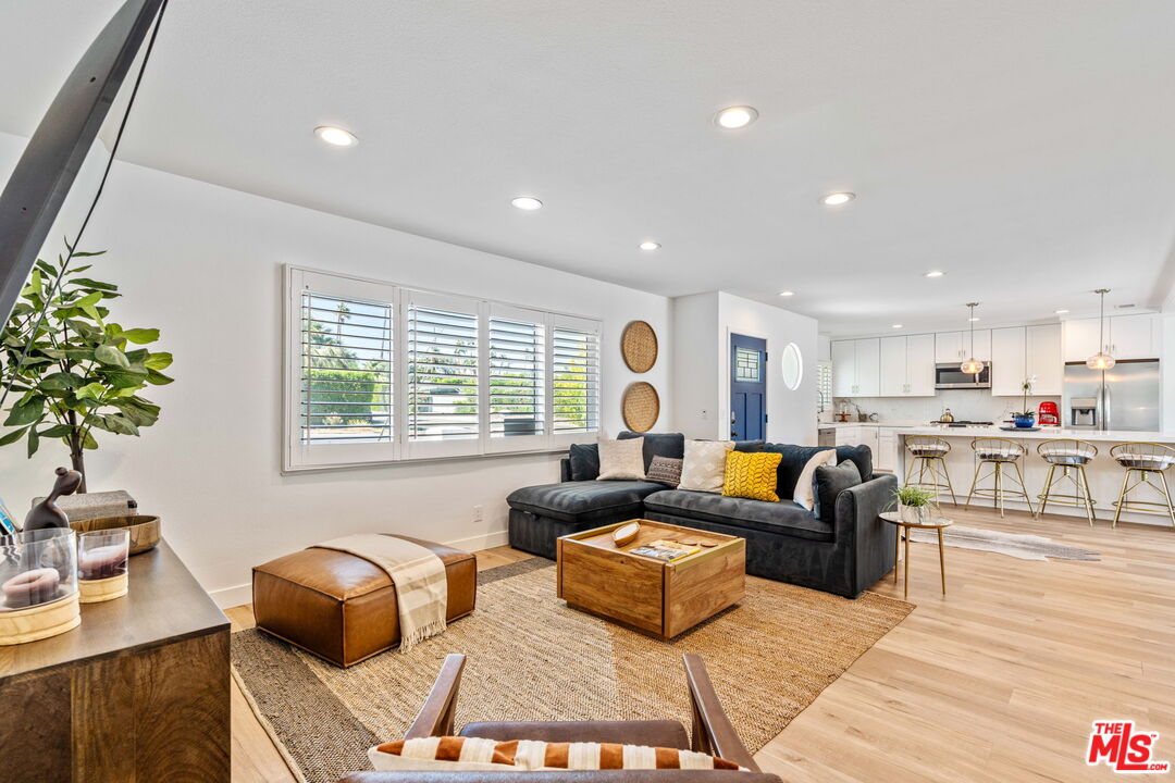 1399 Tamarisk Road Palm Springs, CA 92262 - Photo 15 of 28 a living room with furniture and a large window