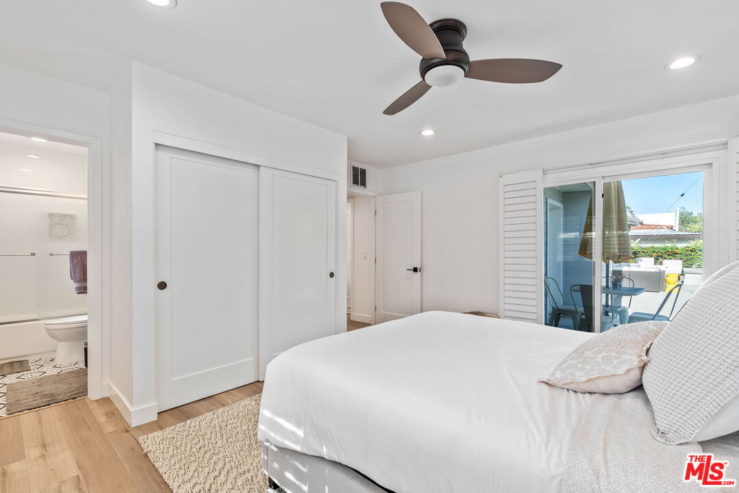 1399 Tamarisk Road Palm Springs, CA 92262 - Photo 17 of 28 a bedroom with a bed and a dresser