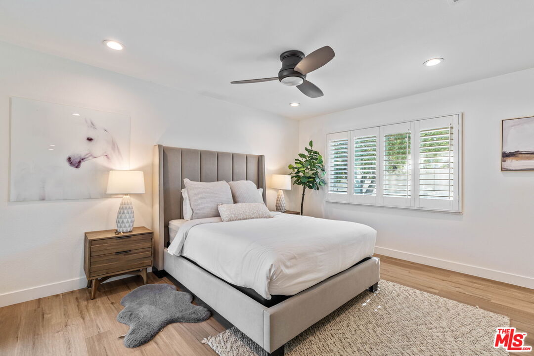 1399 Tamarisk Road Palm Springs, CA 92262 - Photo 18 of 28 a bedroom with a bed and a window