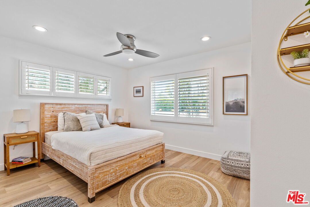 1399 Tamarisk Road Palm Springs, CA 92262 - Photo 22 of 28 a bedroom with a bed and a window
