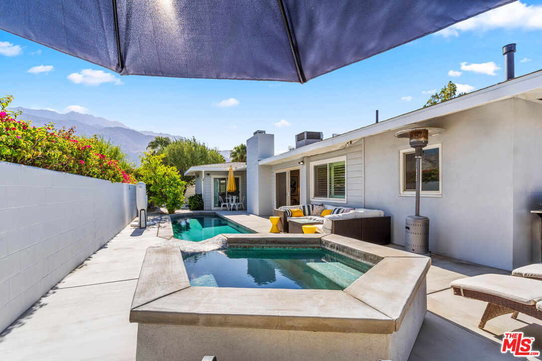1399 Tamarisk Road Palm Springs, CA 92262 - Photo 25 of 28 a view of swimming pool with outdoor seating