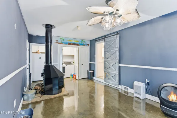 a view of a livingroom with furniture and a chandelier