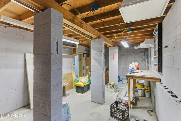a kitchen with granite countertop a sink and a stove